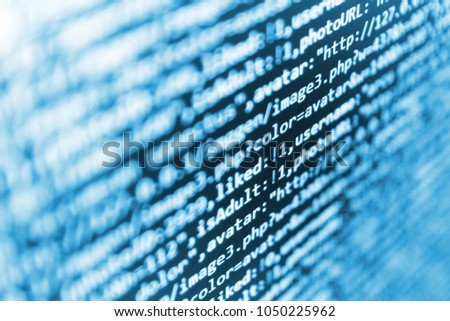 Binary digits code editing. Programing workflow abstract algorithm concept. Software engineer at work. Writing programming code on laptop. Digital technology on display. Creative focus effect. 
