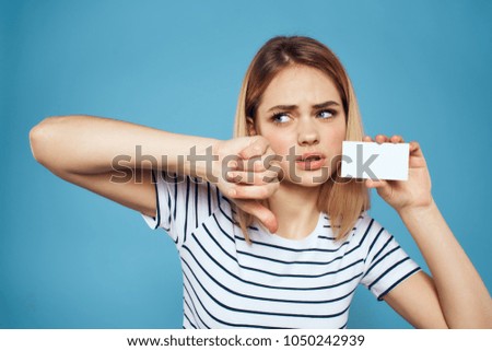 sad woman with business card holding finger down                               