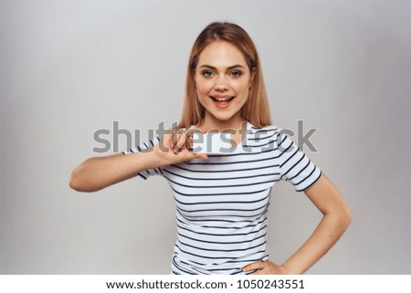 woman is smiling with a business card