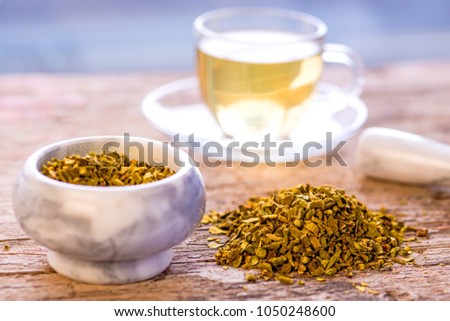 mistletoe, medicinal herb, dried with mortar and tea cup