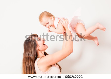 Mother toss up the baby