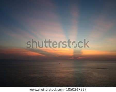 Sea and blue sky with cloud in beautiful golden orange sunset time at over the ocean.