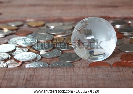 Map world glass on coins , finicial concept.