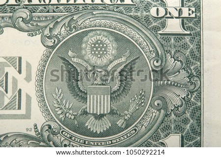 Partial view of a USA one dollar bill showing portrait of George Washington and phrase: "This note is legal tender for all debts, public and private