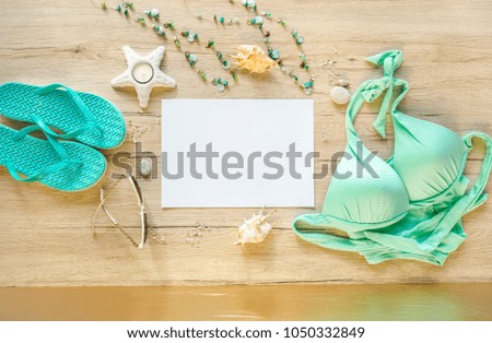 Going to the vacation concept. Free space for decoration. Beach vacation accessories on wooden background. Wide angle, top view.
