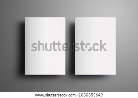 Two universal blank closed A4, (A5) brochures with soft realistic shadows  isolated on gray background. Top of view. Template can be used for your showcase.  Royalty-Free Stock Photo #1050355649
