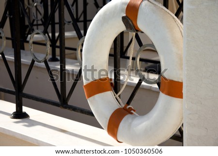 Life ring on the fence at a swimming pool near the Mediterranean sea.Cyprus