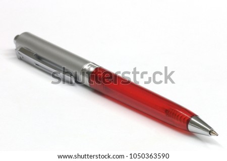 red ballpen with White background Royalty-Free Stock Photo #1050363590