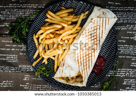 beef tacos served with golden French fries 