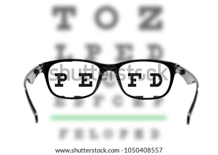 Looking eyes test chart with eyeglasses is clear vision for shortsighted. Royalty-Free Stock Photo #1050408557