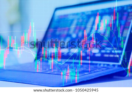 Double exposure Technical price graph and indicator, red and green candlestick chart and stock trading computer screen background Market volatility, up and down trend. Crypto currency theme background Royalty-Free Stock Photo #1050425945