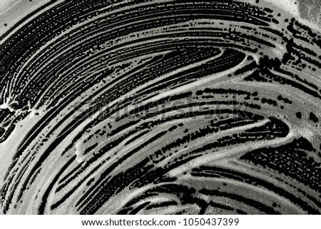 Wipe cleaning washing bubble foam stain on black background curve shape