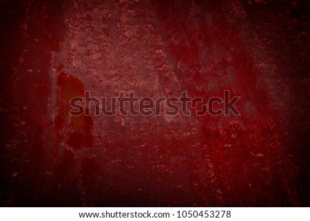 Fire and lava in darkness under ray of dispersed or scattered light abstract art background. Oil painting on linen canvas. Black and red tones texture. Dimmed picture fragment. Brushstrokes of paint