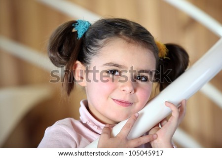 portrait of cute little girl with pigtails