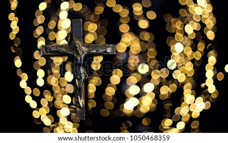 Crucifixion Of Jesus Christ.Holy cross, crown of thorns and nail on light golden bokeh. Easter and Good friday concept.Worship God concept.