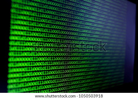 Binary Code Background. Technology abstract green background, green binary code on computer screen texture background. An image of a binary code made up of a set of green digits on a black background