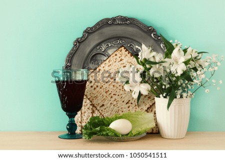 Pesah celebration concept (jewish Passover holiday). Translation for Hebrew Text: egg