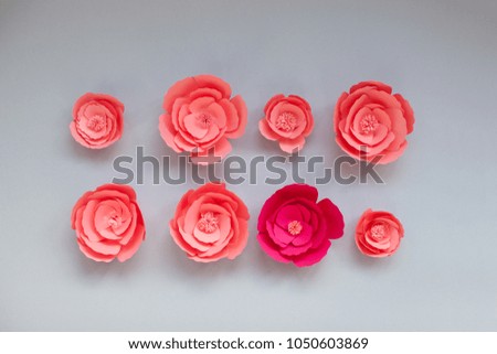 Colorful handmade paper flowers on on a light background for wedding invitation, isolated, paper art, cut.