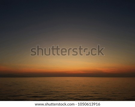Photo of gloomy sky and sea coast at sunset