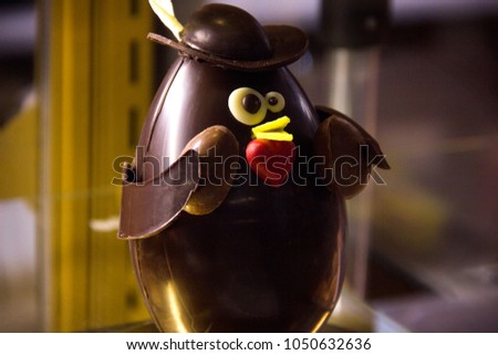 chocolate product bird behind the showcase glass