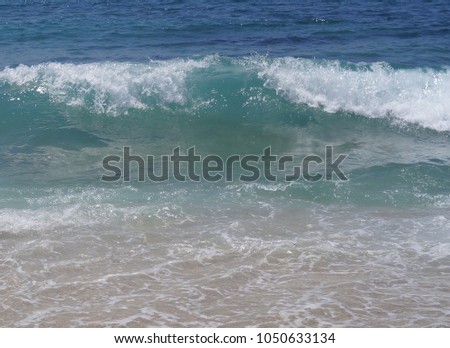 Waves break on the shore