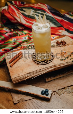 pear punch with pieces of pear. on a wooden stand in Asian style