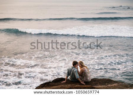 Amazing and happy couple on the sunset 