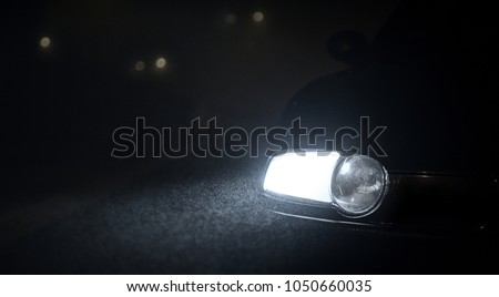 Car head lights in the night Royalty-Free Stock Photo #1050660035