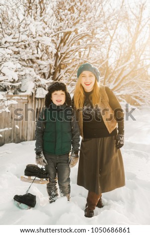girl and boy with skates being photographed together