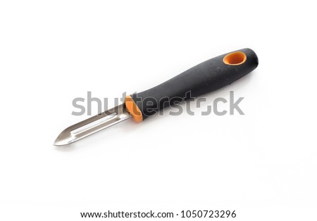 Knife for cleaning vegetables peeler isolated on white background Royalty-Free Stock Photo #1050723296