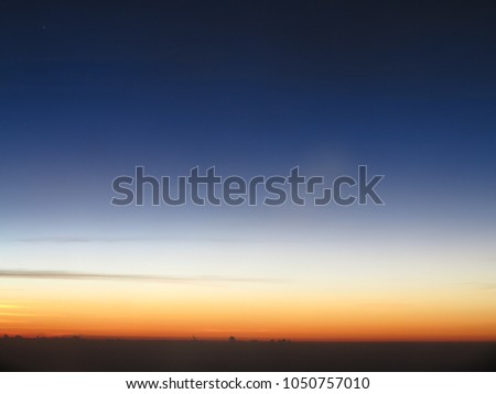 Blue sky and clouds with beautiful golden orange sunset time with light sunrise nature, picture from plane.