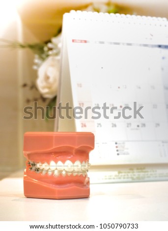 Clear braces - invisible brackets for teeth straightening Royalty-Free Stock Photo #1050790733