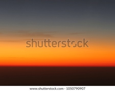 Blue sky and clouds with beautiful golden orange sunset time with light sunrise nature, picture from plane.