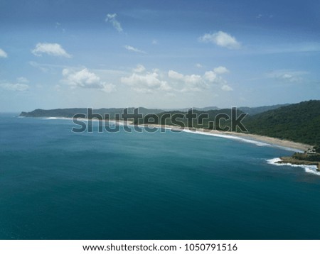 Calm ocean coastline background aerial drone view