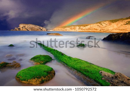 Beautiful rainbow on the rocks and the sea....