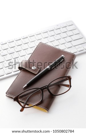 Business image, notebook, glasses and keyboard