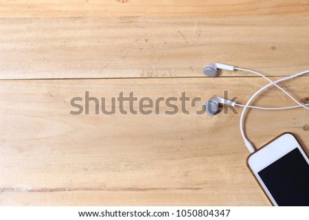 White Smartphone and Earphone at Wooden Desk, Flat Lays or Top View