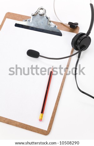 a black headset and clipboard close up