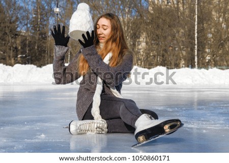 young beautiful girl ice skating