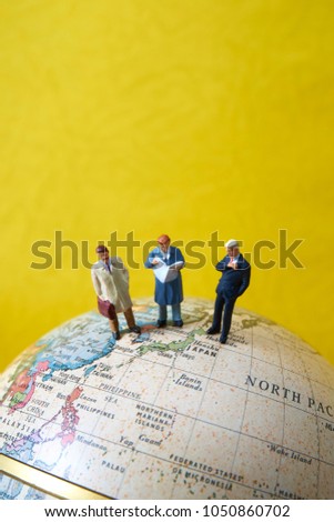  Businessman's miniature doll and the globe                              