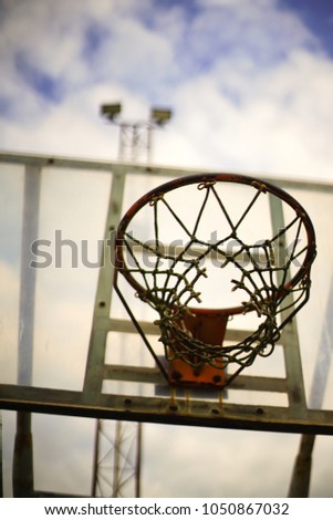 Basketball hoop in the park with blue sky as background. outdoor sport