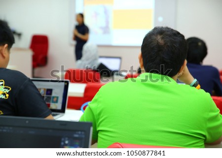Abstract photo of conference hall or seminar room with attendee background