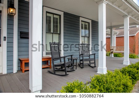 rocking chairs on the porch Royalty-Free Stock Photo #1050882764