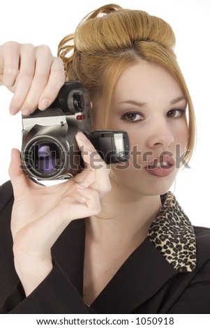 Beautiful young woman with digital camera.  Shot in studio over white.