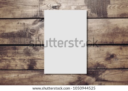 Paper blank on brown wooden desk