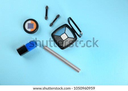 Decorative cosmetics on color background