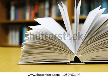 Opened book on table