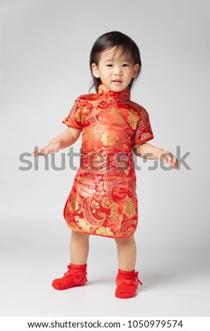 Asian Chinese Little girl is feeling good with gift from Chinese new year traditional