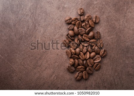 Closeup of natural coffee beans on a wooden table