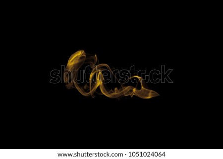 Beauty gold smoke, movement soft golden fire flame, Abstract and texture of amazing magic golden smoke on black background